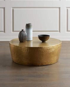 a coffee table with two bowls on it