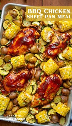 bbq chicken sheet pan meal with corn, potatoes and zucchini on the side