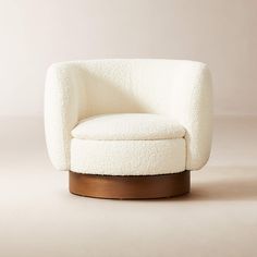 a white chair sitting on top of a wooden base