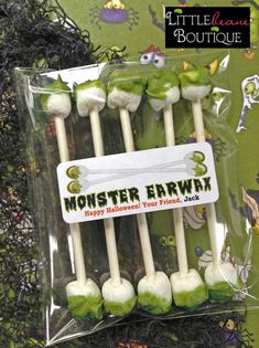 green and white marshmallows are in the package for halloween party favors on display