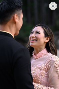 a man and woman standing next to each other