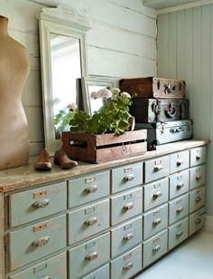 an old dresser with lots of drawers in it