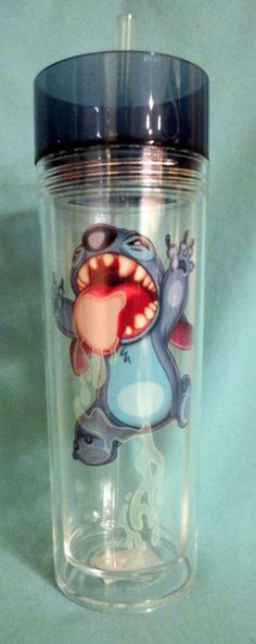 a glass cup with an image of a cartoon character on the front and bottom half