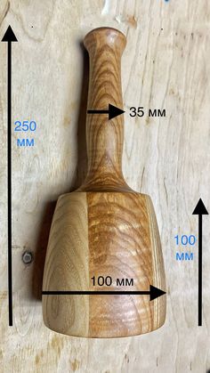 a wooden object is shown with measurements for the top and bottom part, including height