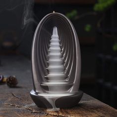 a stack of plastic spoons sitting on top of a wooden table next to other items