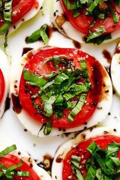 tomatoes and mozzarella are arranged on top of each other