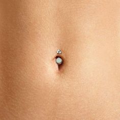 Introducing the gorgeous Crown Jewels Navel Ring—the ultimate accessory for your navel piercing. This luxurious belly ring is available with a selection of stunning natural gemstones. Choose from natural opals, amethyst, and rose quartz, and add a touch of regal elegance to your belly piercing. Each belly button ring is meticulously crafted to ensure unparalleled brilliance and to last a lifetime. Top gems measure 3mm each Bottom gem measures: 8mm (7mm for Black Opal) Natural Gemstones Solid 14k Amethyst And Rose Quartz, Regal Elegance, Navel Ring, Navel Piercing, Belly Piercing, Belly Button Ring, Navel Rings, Button Ring, Belly Ring