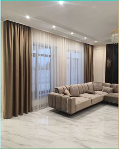 a living room with marble flooring and curtains