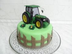 a green cake with a tractor on it