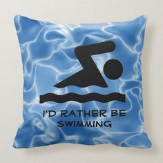 a pillow that says i'd rather be swimming in the water with an image of a swimmer