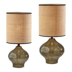 two lamps with shades of green and brown on each lamp are next to each other