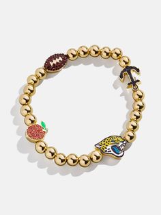 The Jacksonville Jaguars NFL Charm Bracelet is the ultimate accessory for die-hard football fans. Each bracelet is a celebration of your favorite team, featuring the Jaguars logo along with other charms related to the team and its iconic location. Perfect for game days or everyday wear, this bracelet adds a touch of sports-inspired elegance to any outfit. This bracelet features 6mm gold ball beads. This is an officially licensed NFL product. Sporty Team-colored Jewelry For Game Day, Sporty Jewelry For Game Day, Adjustable Bracelets For Game Day, Football Season, Casual Personalized Jewelry For Game Day, Jaguars Logo, Beaded Charm Bracelet, Jacksonville Jaguars, Bead Charm Bracelet, Die Hard