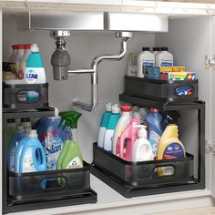 two black bins filled with cleaning products