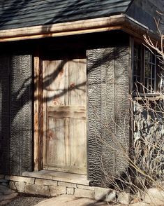 an old building with a wooden door and window