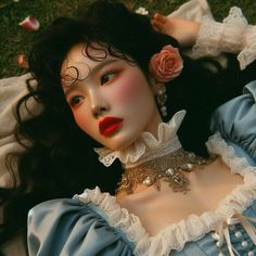 a close up of a doll laying on the ground