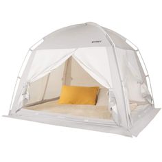 a bed with a white tent on top of it