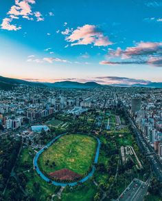 an aerial view of the city and its surrounding park