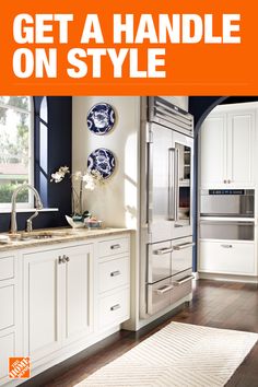 a kitchen with white cabinets and an orange sign that says get a handle on style