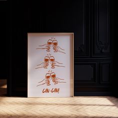 an art print with the words can - cin on it in front of a wooden floor