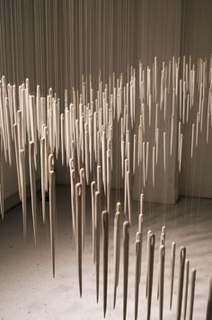 an art installation made out of wooden sticks