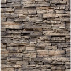 a stone wall that has been made out of different types of rocks and is brown