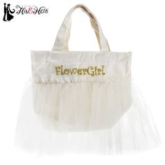 a white tote bag with the words flower girl written on it and a tulle skirt underneath