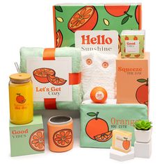 an assortment of orange products are displayed on a white surface with green and orange designs