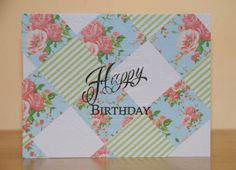 a happy birthday card with flowers on it