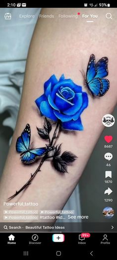 a blue rose with two butterflies on it's arm and the caption below