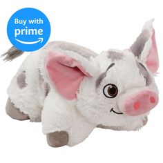 a stuffed animal that is laying down on the ground with it's eyes wide open