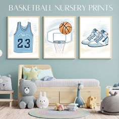 a bedroom with two basketball nursery prints on the wall and toys in front of it