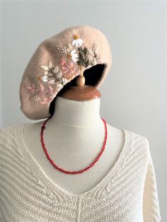 Elegant handmade Embroidered Beige french Beret! Carefully hand-sewn and crafted, this beret is made of a soft 100% wool that can keep you warm and comfortable in winter! Material: 100% wool, solid and thick Size: one size fits most for women Embroidery: 100% hand made with embroidery threads Color: each color features different flower pattern ❤This would also make a great gift for someone's birthday, Christmas or any other special occasion. ❤All your orders will be sent in a handmade fabulous gift packaging.. ❤ I am also open for item customization. If you want a certain pattern on a different color hat, or add additional design to an existing pattern, please contact me. ❤CARE INSTRUCTIONS: Hand wash - warm maximum wash 30oC. Cold rinse. Do not wring. Do not iron. Dry cleanable. Do not bl Beige Beret, Embroidered Beret, French Hat, Custom Embroidered Hats, Embroidery Crochet, Towel Weaving, French Beret, Hat Beret, Winter Cap