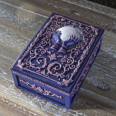 a purple box with an intricate design on it