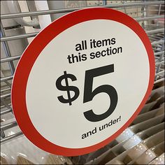 a red and white sign that says all items this section $ 5 and under on it