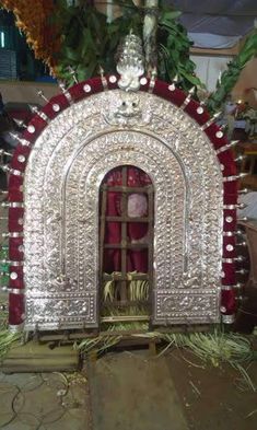 an elaborately decorated shrine with red and white decorations