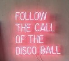 a neon sign that says follow the call of the disco ball