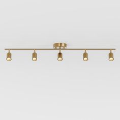 five light brass track fixture with four bulbs on each end and three lights in the middle