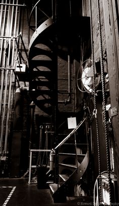 a spiral staircase in an industrial building