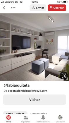 a living room filled with furniture and a flat screen tv sitting on top of a wall