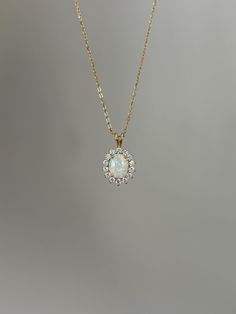 One of my personal favorites, this opal necklace is a must-have! Information: ✨ Simulated Opal Gemstone | High Quality ✨ Sterling Silver (925 stamped) | 14K Gold Plated ✨ AAA Cubic Zirconia diamonds ✨ Adjustable length: 16" - 18" ✨ Hypoallergenic  ✨ Tarnish resistant A classic, this necklace is the perfect addition to you collection - it holds a beautiful sophisticated vibe that upgrades your outfit instantly. Personally, I wear this piece quite often and the sparkles are so strong that I am alw Opal Birthstone Necklace For Anniversary, Oval Opal Necklace For Wedding, Formal Opal Necklace With 17 Jewels, Elegant Ethiopian Opal Pendant Necklace, Opal Round Pendant Necklace For Anniversary, Yellow Gold Opal Necklace For Anniversary, Formal Opal Round Necklace, Anniversary Opal Round Pendant Necklace, Anniversary Opal Necklace With Round Pendant