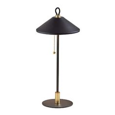 a black and gold lamp on a white background