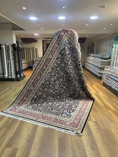 a carpet store with lots of rugs on the floor