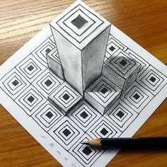 a pencil drawing of a cube on top of a wooden table next to a pen