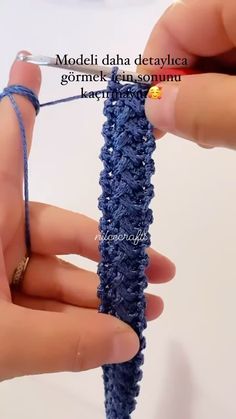 someone is knitting something with blue yarn