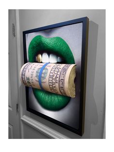 a rolled up roll of money sitting on top of a green lipstick