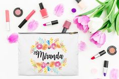 a white bag with flowers and makeup on it