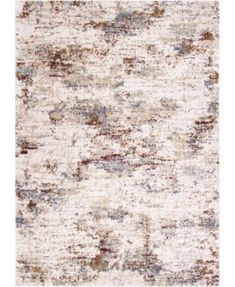 an area rug with various colors and patterns on it, including white, brown, blue and