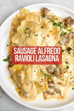 sausage alfredo ravioli lasagna on a white plate with a red sign that reads sausage alfredo ravioli lasagna