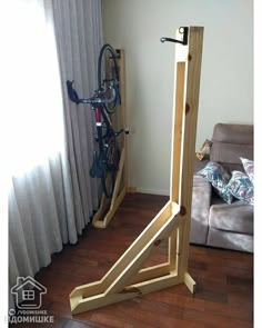 a wooden bike rack in the corner of a living room