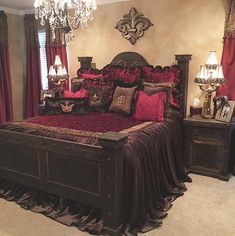 a bedroom with a bed, dressers and chandelier in it's center